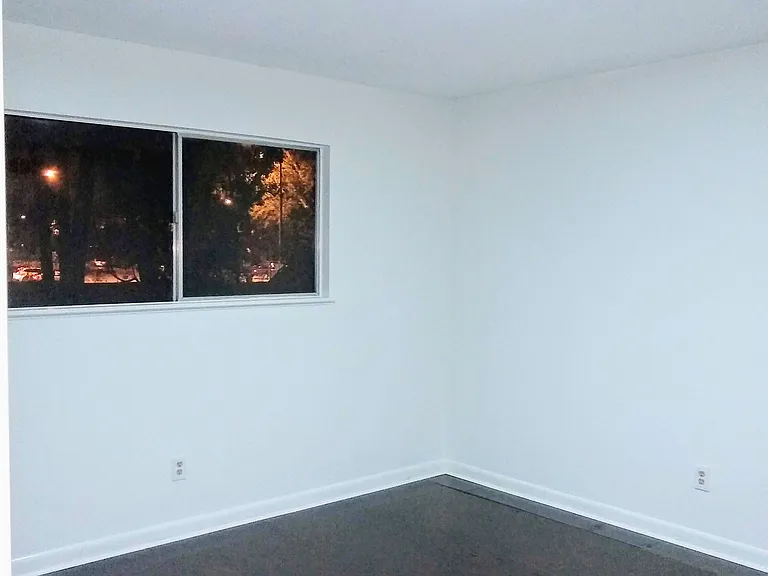 Bedroom. Rear facing window with private views day and night.