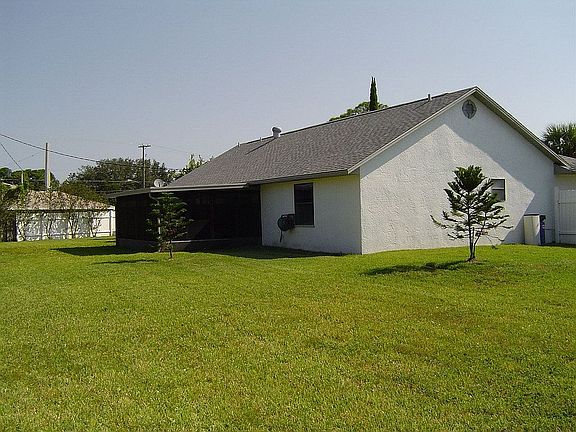 HOUSE SITS ON 1/2 ACRE