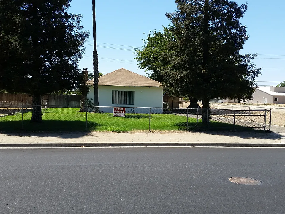 Fenced sprinkled yard with locking front gate and side gate to rear yard. Lawn services are included in the rent.