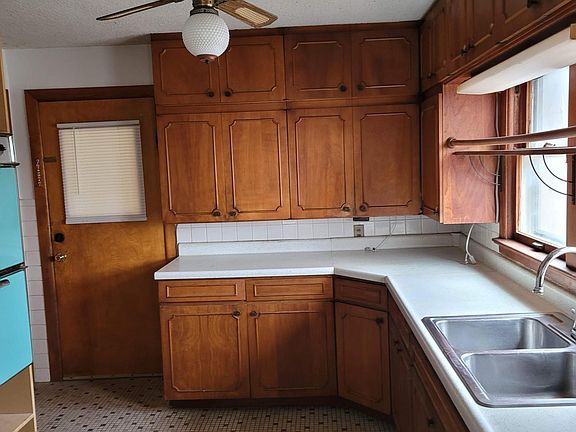 Kitchen features tons of storage and plenty of natural light. Electric stove, double oven. No refrigerator; bring your own! Laundry machine connections available.