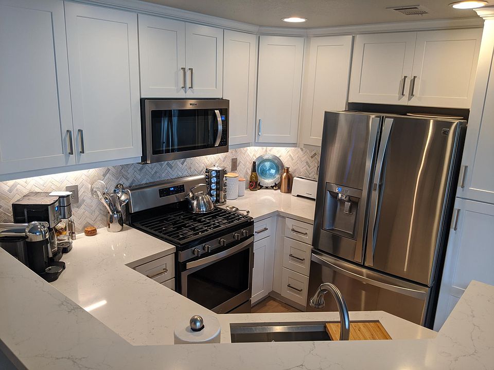 Newly remodeled, wood soft close, marble backsplash, quartz counters.