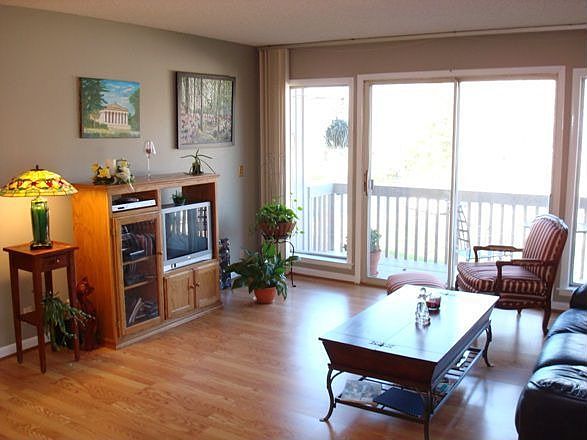 Pergo wood floors extend through the LR & DR and down the hall to the bedrooms