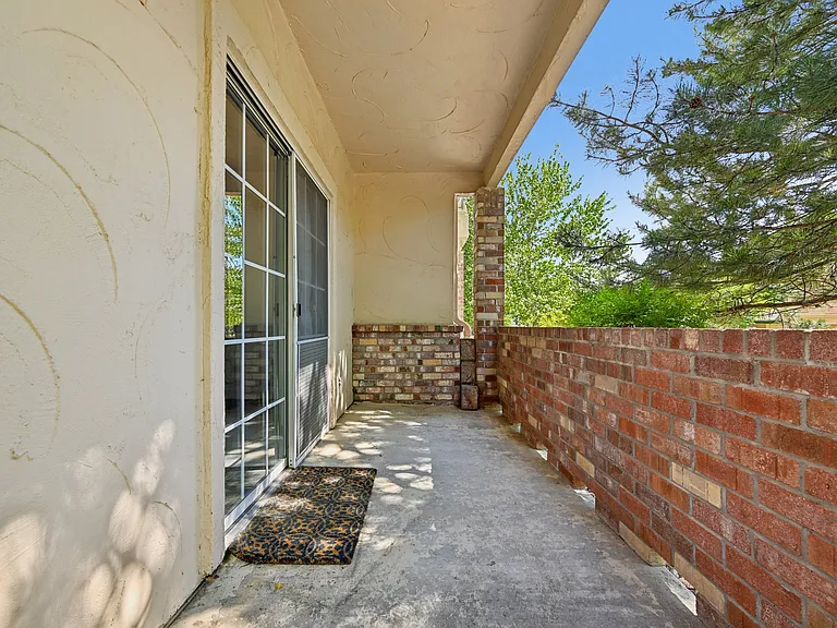 Private covered deck that overlooks courtyard.