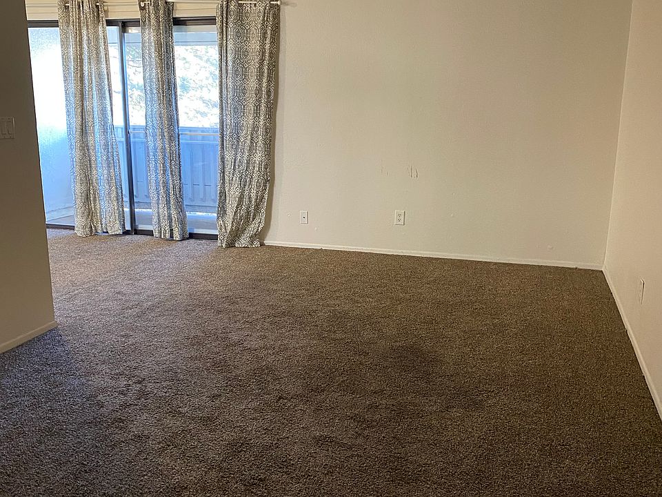 Full window coverings. Sliding door with access to deck.