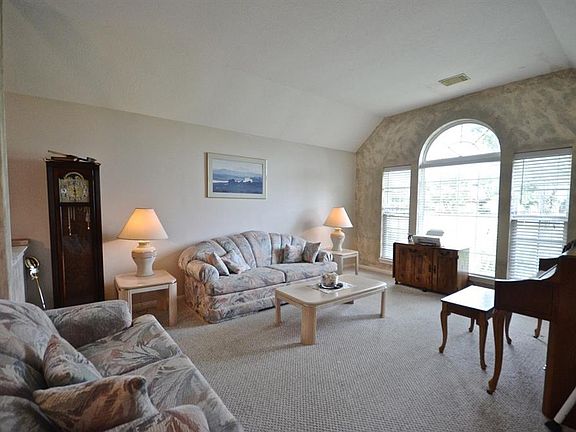 Huge formal living area. Lots of natural light from the arched floor to ceiling windows. Come on in and make yourself at home.