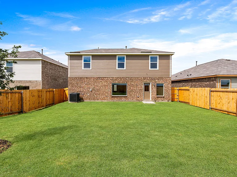 The back yard of the Cypress is large and fully fenced-in.