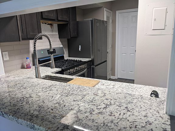 View looking into kitchen.
The microwave is not installed yet supply chain issue. Same with cabinet over refrigerator.