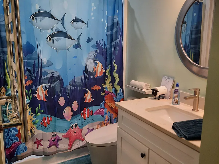 Master bathroom, standing shower, toilet bidet, heated towel rack.