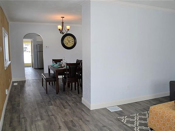 Living room opens to dining room for easy flow when entertaining.