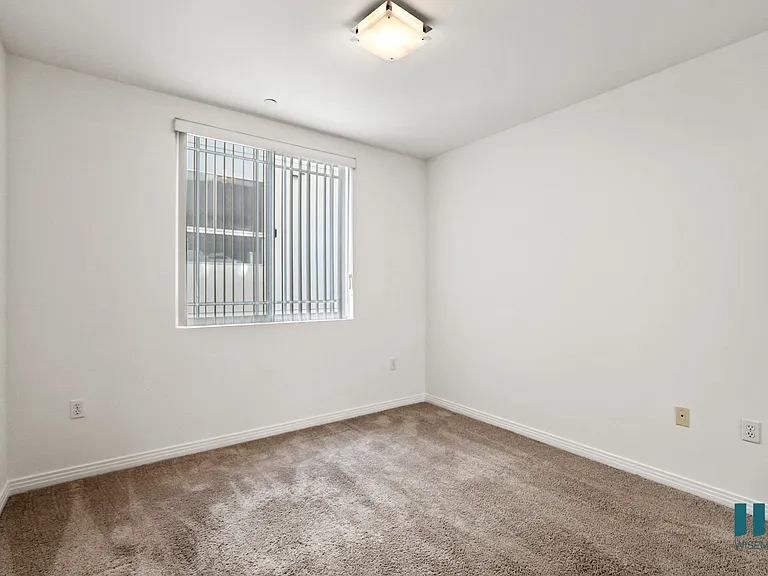 Bedroom with Window and Carpet