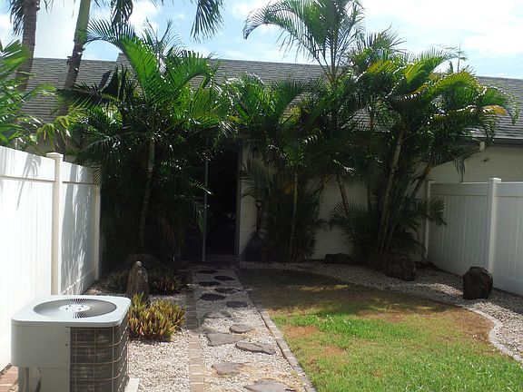 View from Kitchen door of yard to detached garage