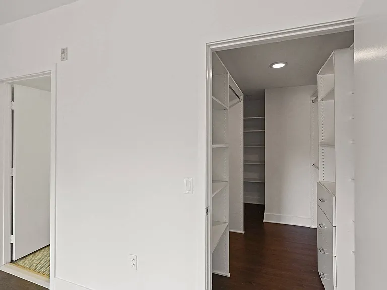 Large Walk-In Closets with Built-In Organizers