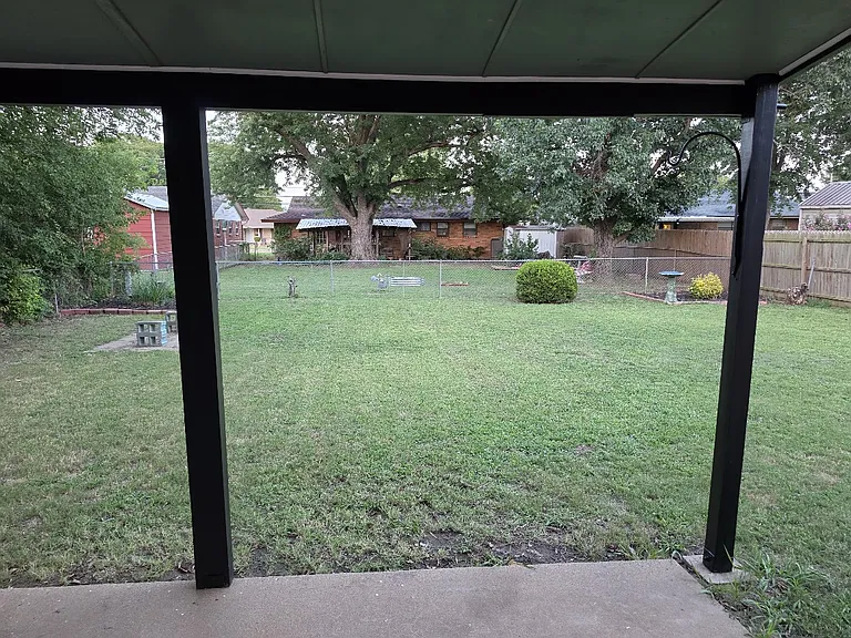 Fenced in back yard with quiet friendly neighbors all around.
