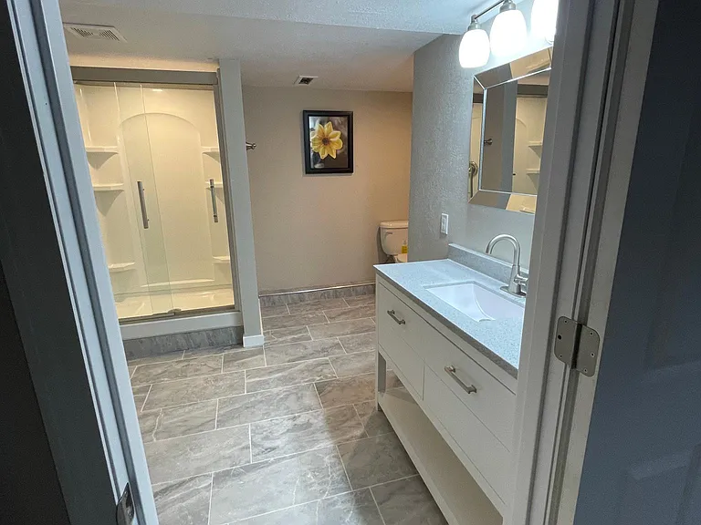 Newly finished lower level 3/4 bath, tile floors