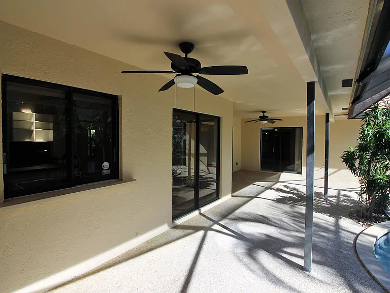 Pool deck enclosure renovated with 
Travertine...