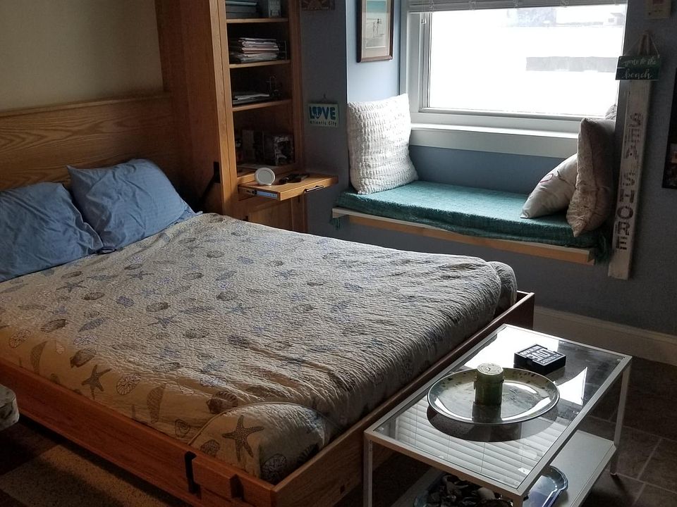 Custom Murphy bed and window seat with ocean view.