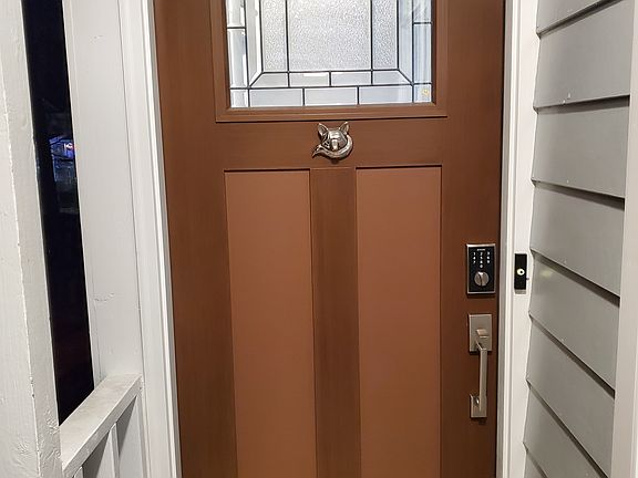 Front door beveled glass. Electronic code lock. Fox door knocker.