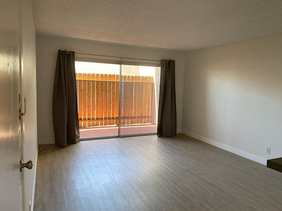 Living room area with patio sliders do patio area.