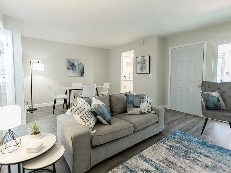 Living Room + Dining Room with Furniture from a Mirrored Unit.