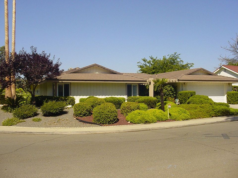 Single story custom home walking distance to golf course and driving range.