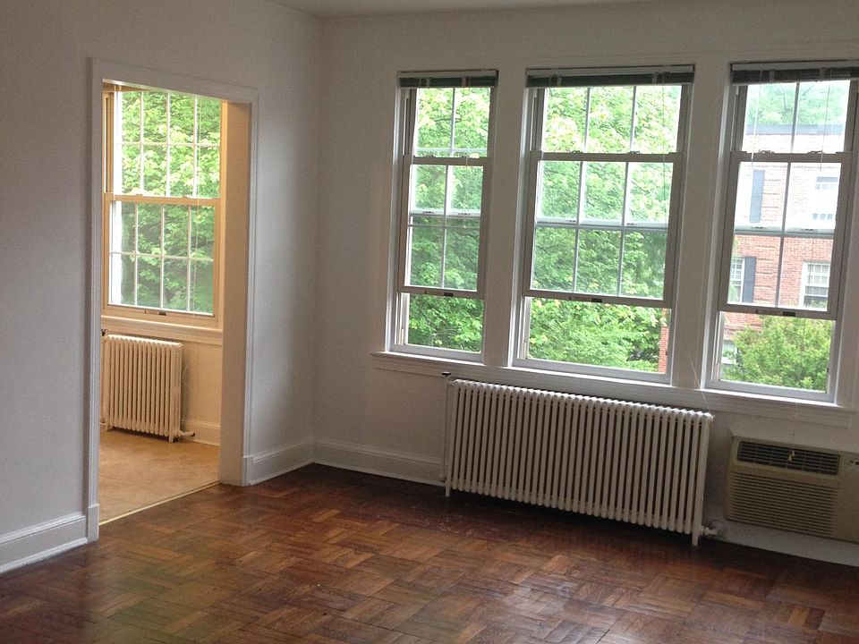 Living room with view to the kitchen. Gets great light and has a nice view of the front courtyard. Wall Intercom to speak to and "buzz in " visitors at building entrance.
