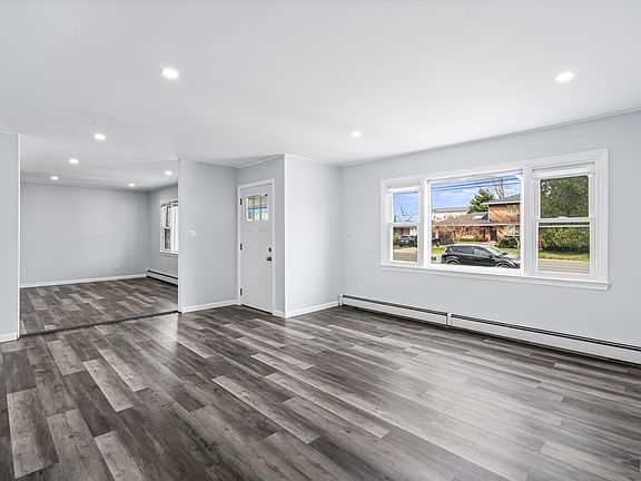 Large living room with big window, open floor plan