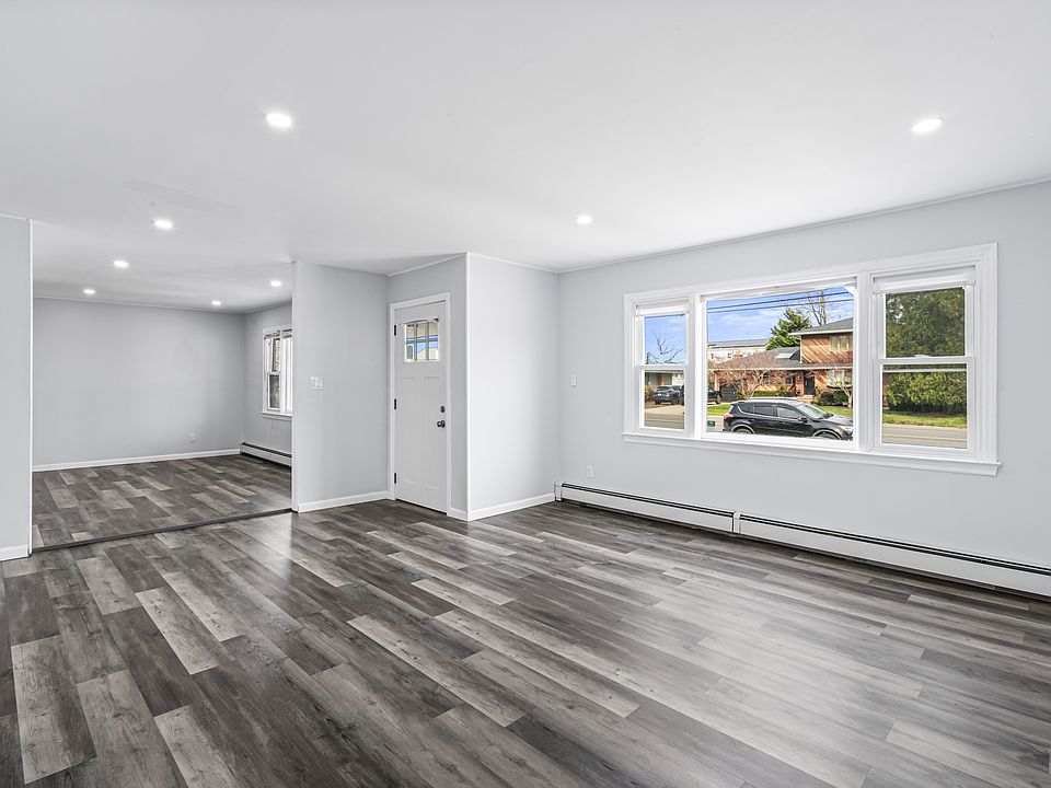 Large living room with big window, open floor plan