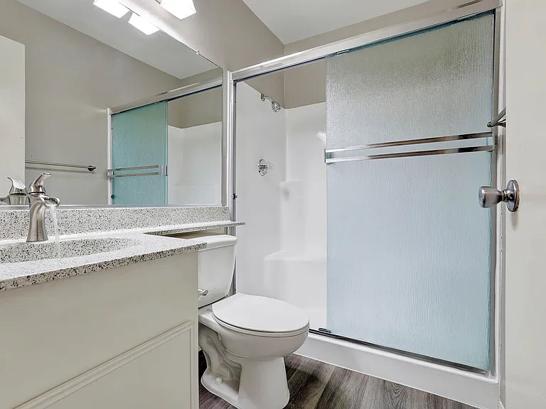 Lake Dianne Apartment Homes Two Bedroom bathroom with a walk-in shower.