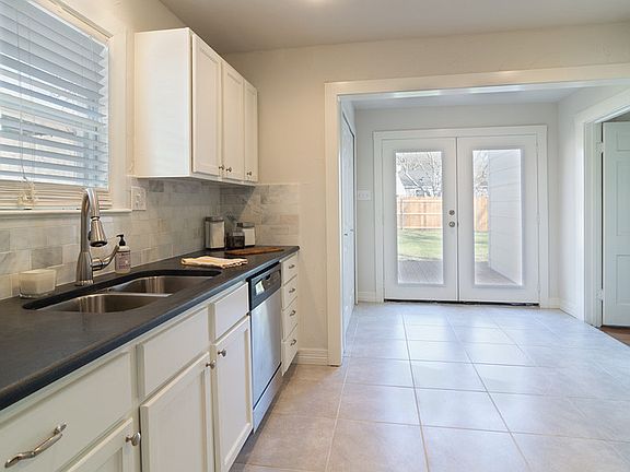 Kitchen
						:
						New Tile Floor and French Doors