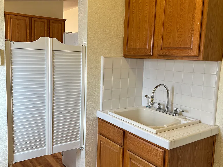 Laundry w/ Cabinets and a Deep Sink