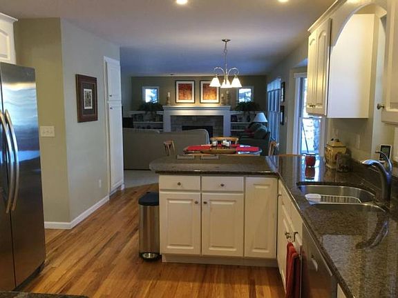 View from kitchen to eating area and large family room - great for entertaining your friends and family