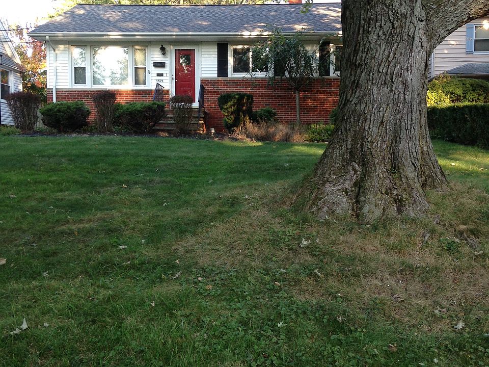 Welcome to 1571 Sunview Rd, a beautiful tree-lined street cl