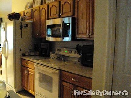 Kitchen
						:
						This kitchen contains a large pantry and cathedral ceilings