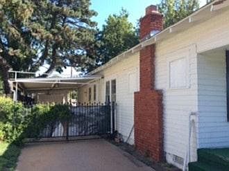 Sheltered driveway with carport and garage