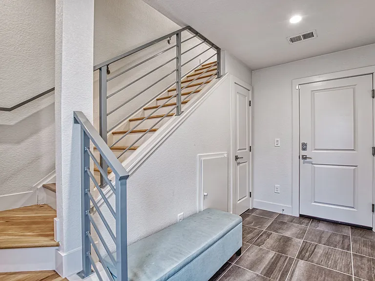 Entryway of home and attached garage door entry
