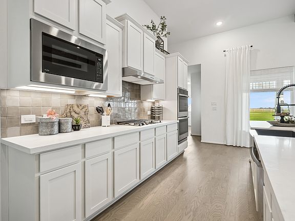 Gourmet kitchen with fabulous ceramic tile backsplash