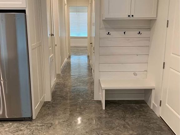 Garage entrance and hall way to bedrooms etc