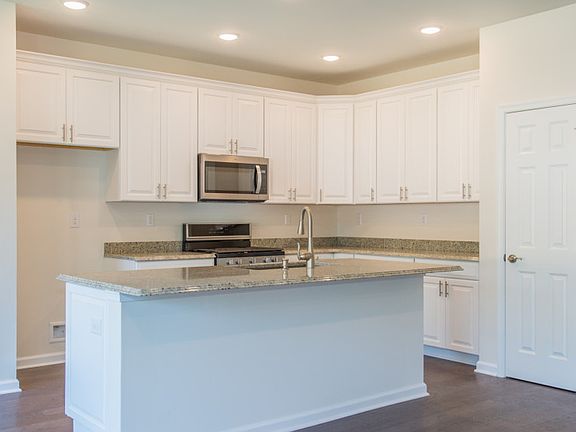 Large center island providing additional seating for entertaining