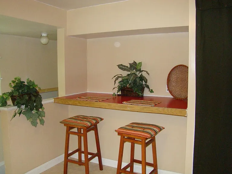 Kitchen nook next to pantry shelves
