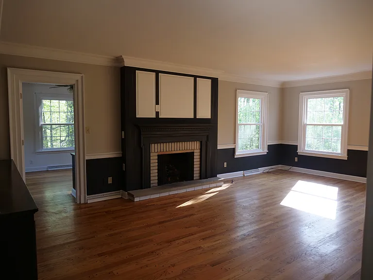 Large living room with gas fireplace and beautiful view of Mill Creek Park.