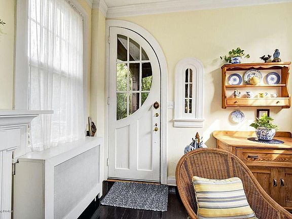 Large living area with four windows.