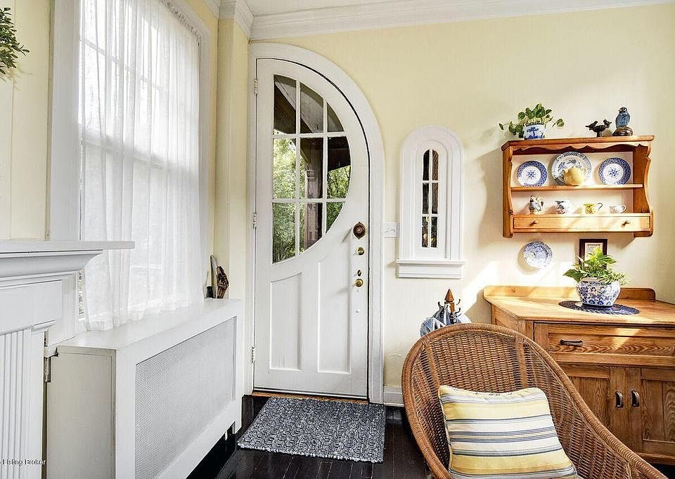 Large living area with four windows.