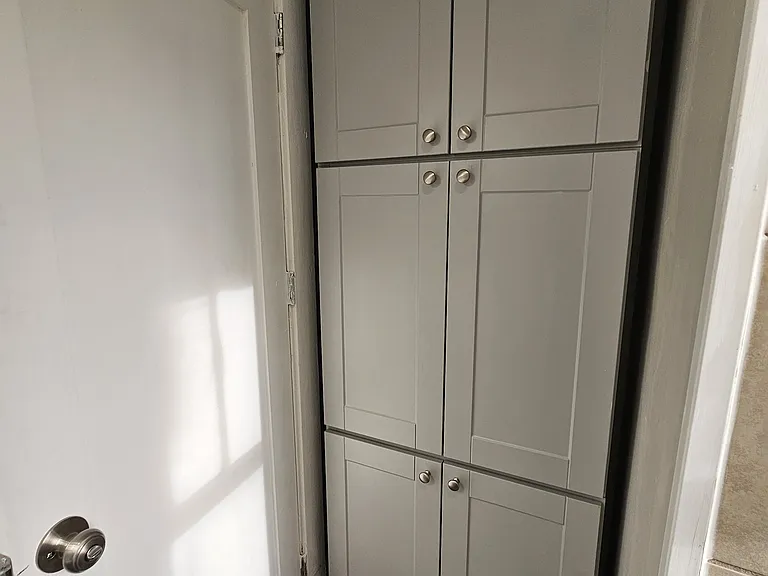 New bathroom with quartz countertops and tons of built-in storage.