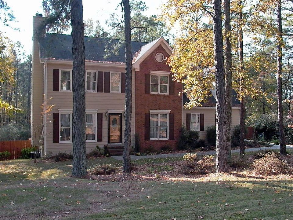 Traditional two story on large lot with brick accents