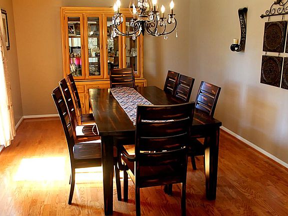 As you enter to your left is the oversized, elegant dining room for entertaining your guests.