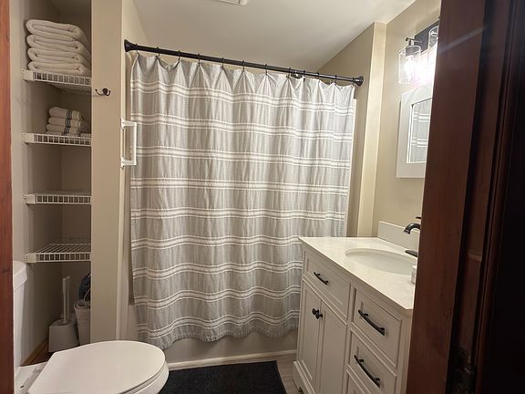 Full size bathroom, tub shower