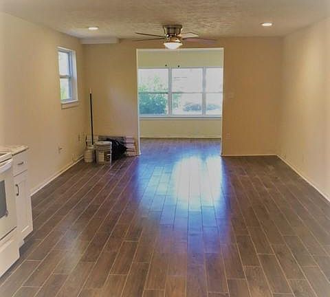 Living room looking from kitchen toward front of apartment