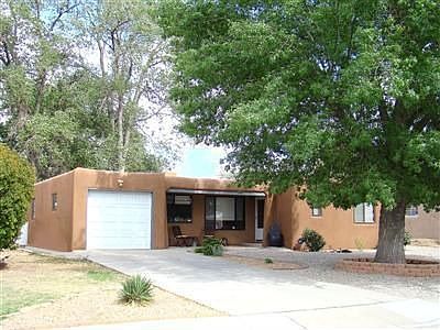 Front of home with large shade tree