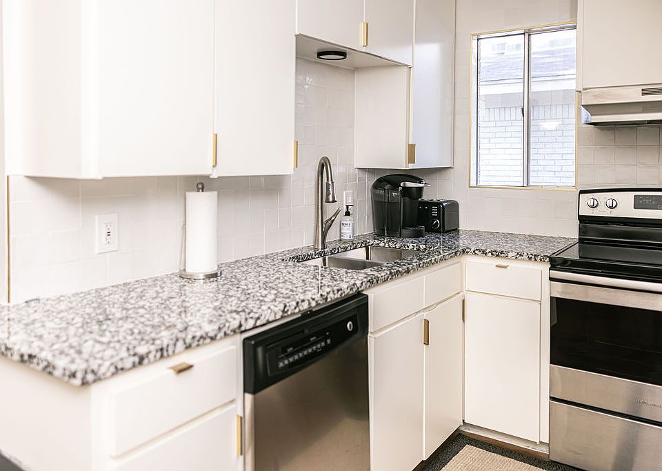 Kitchen - Granite Countertops & new stainless steel/ black appliances.