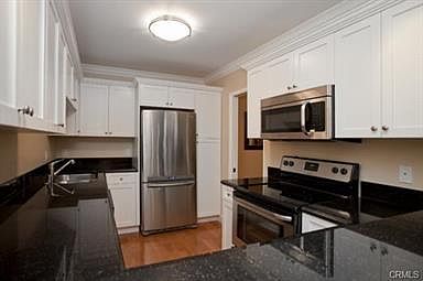 Kitchen with Granite Counter Tops and State of The Art Appli